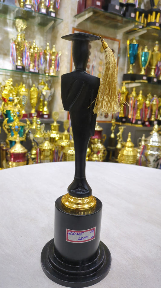 Black acrylic graduation trophy with gold accents.